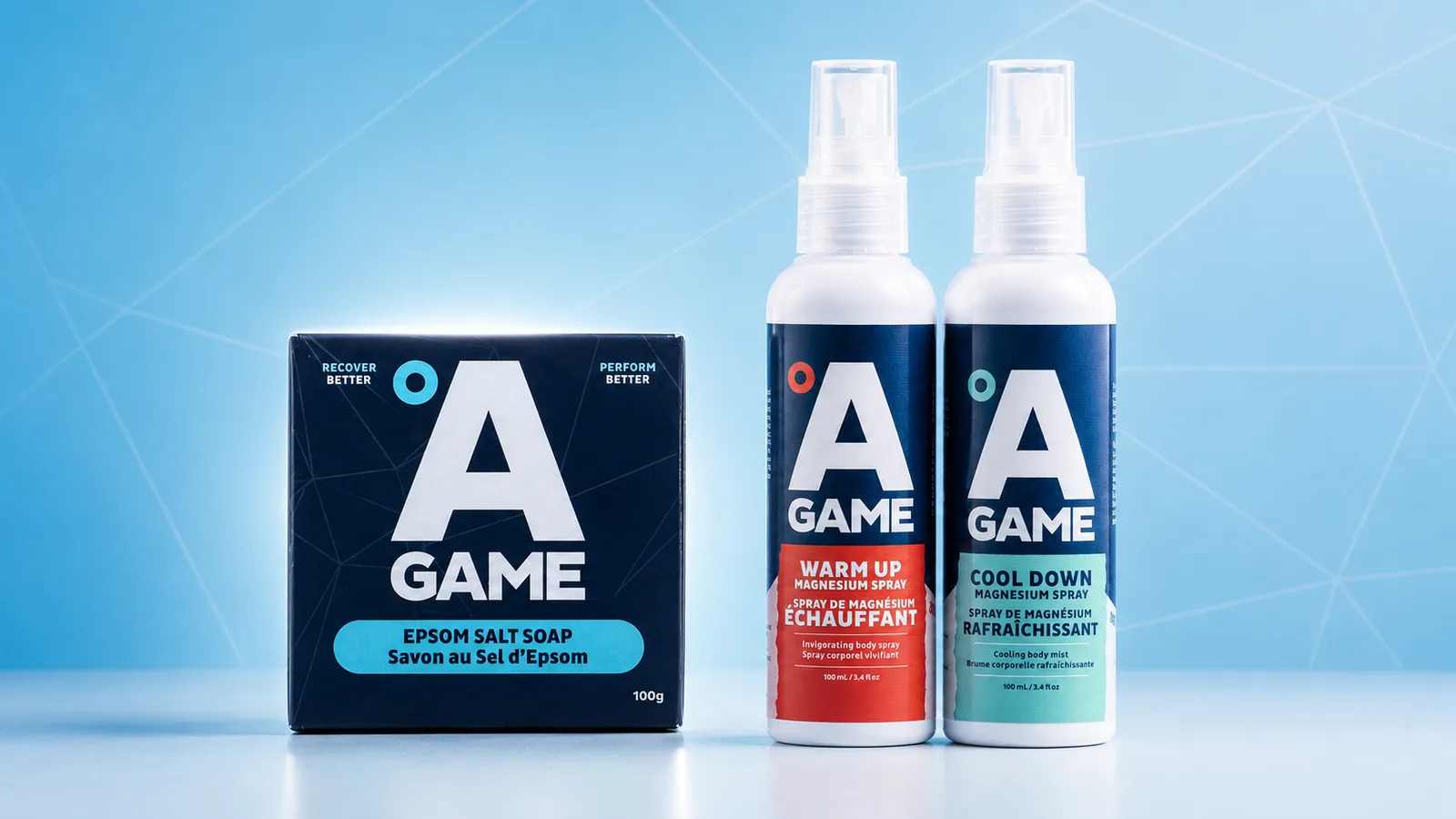 Warm Up spray, Cool Down spray and Epsom Salt Soap styled together on a brand backdrop